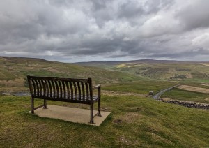 Bench seat overlooking view down valley, Swaledale, Yorkshire
